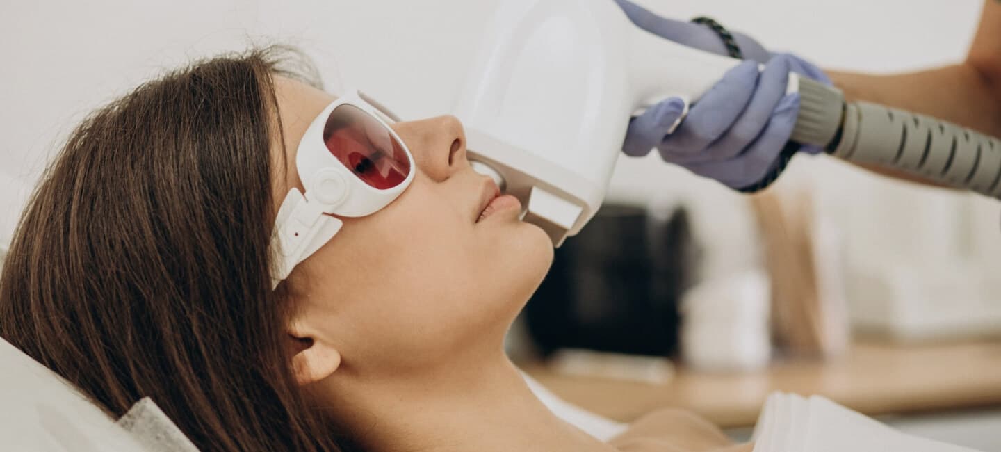 A client receiving laser hair removal treatment